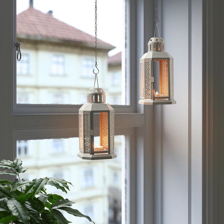 two lanterns for tealights hanging near window