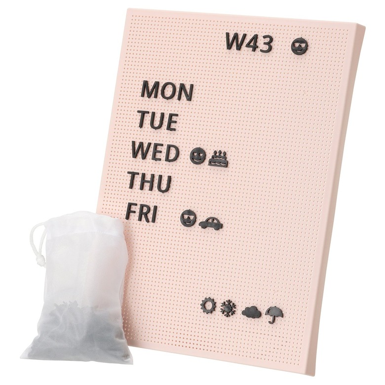 pink pegboard with black letters