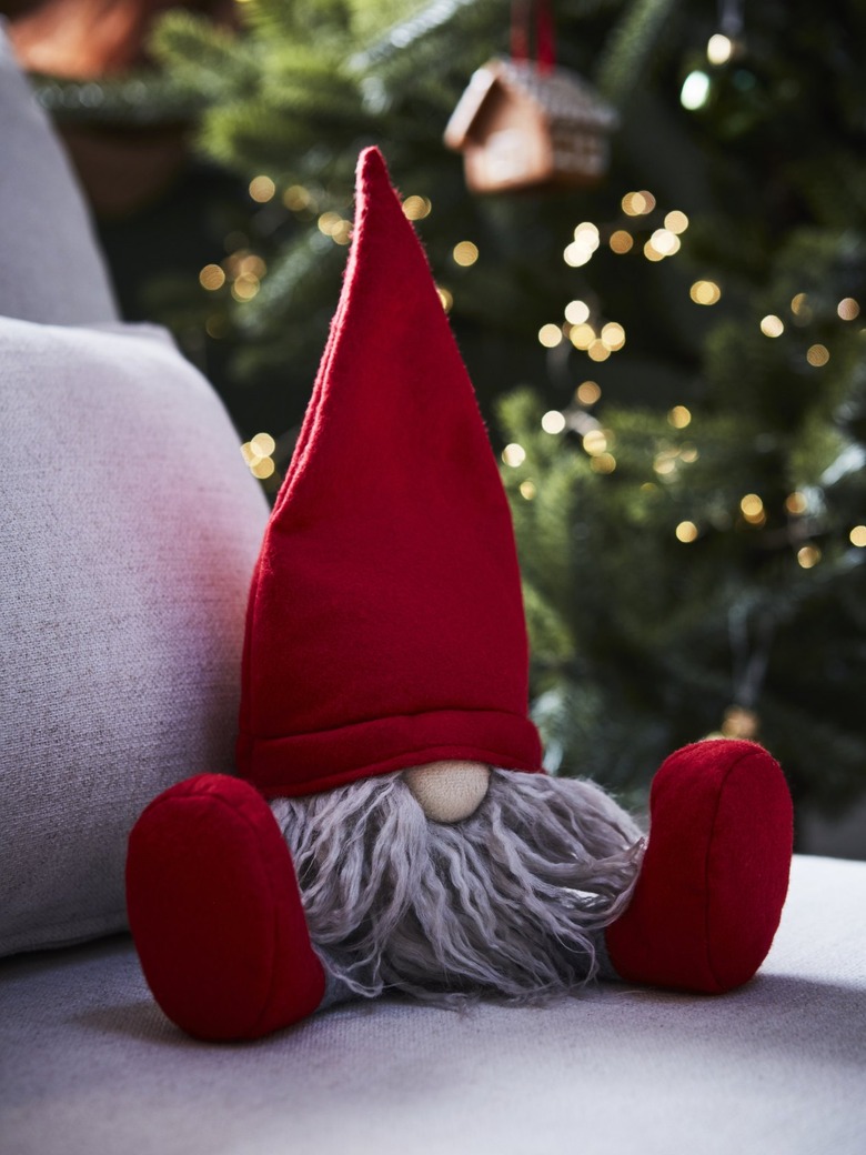 A stuffed gnome with a red hat