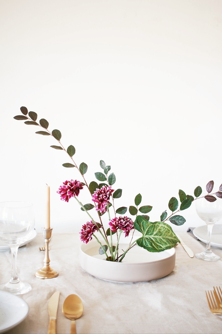 ikebana flower arrangement used as centerpiece on table