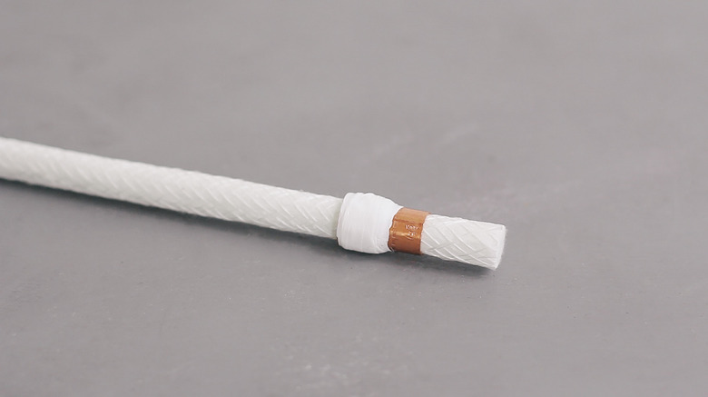 Sliding torch wick through copper coupling