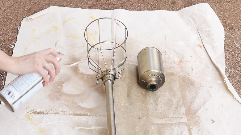 Spray painting torch and bottle brass