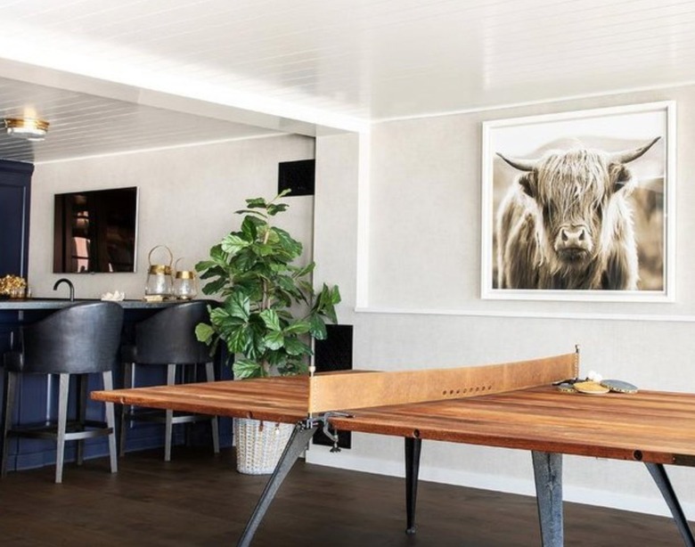Basement with white shiplap walls and ceiling