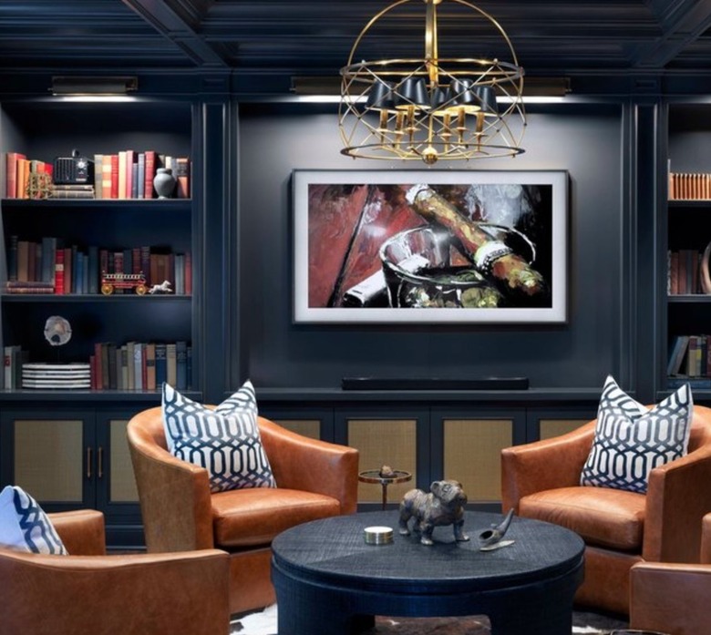 Man cave basement with dark gray walls and ceiling