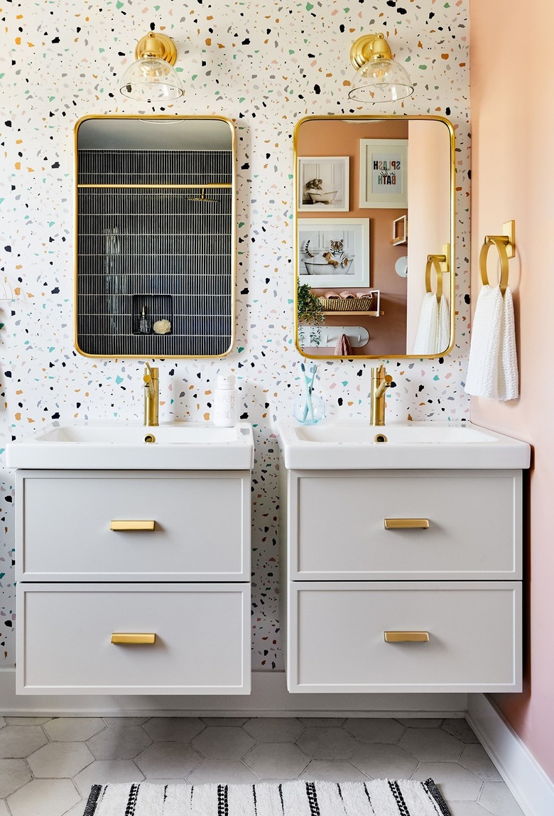 kids bathroom with terrazzo wallpaper and jack and jill vanities