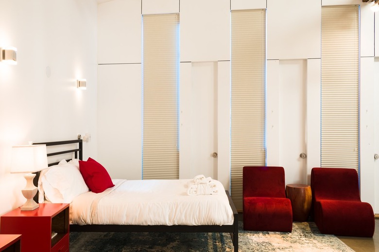 Hotel bedroom with queen bed and black bed frame