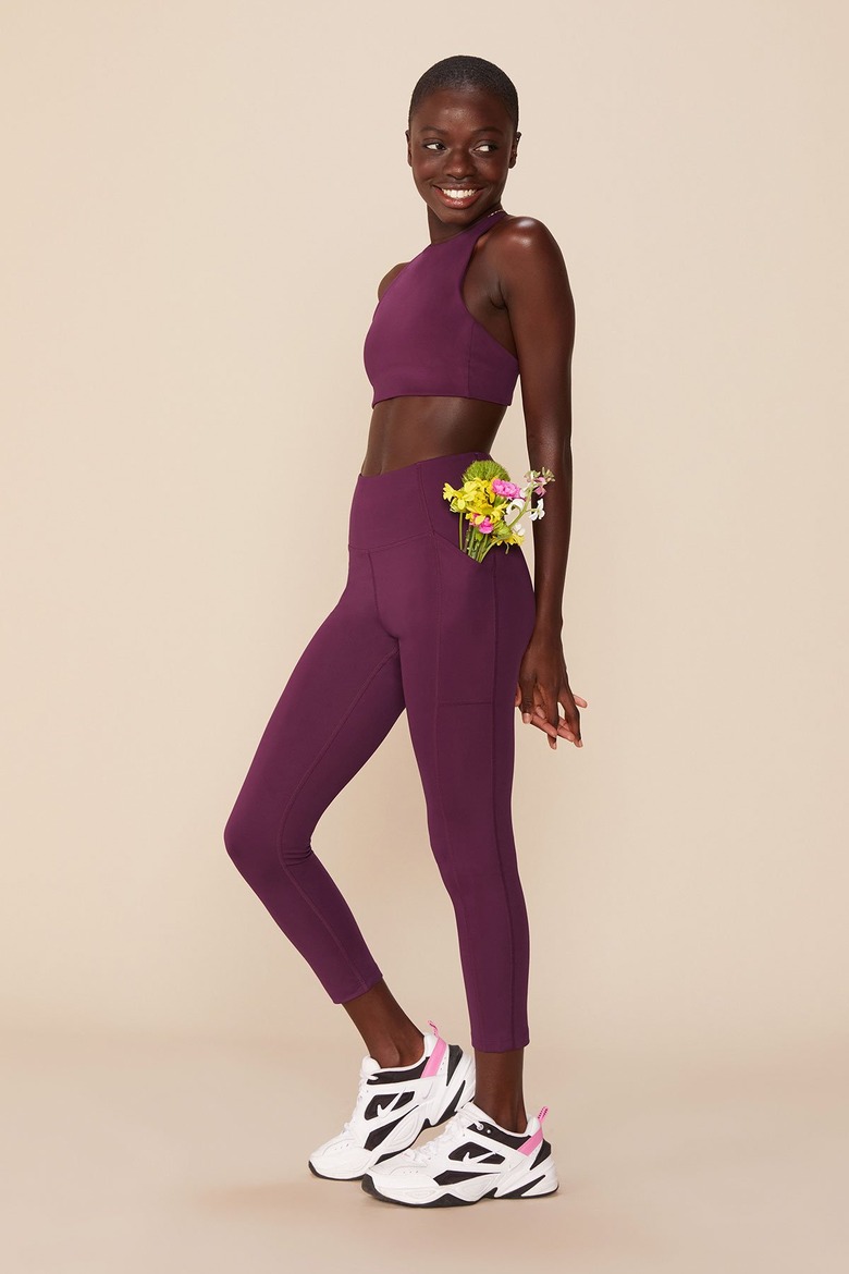girlfriend collective legging and bra set in plum color