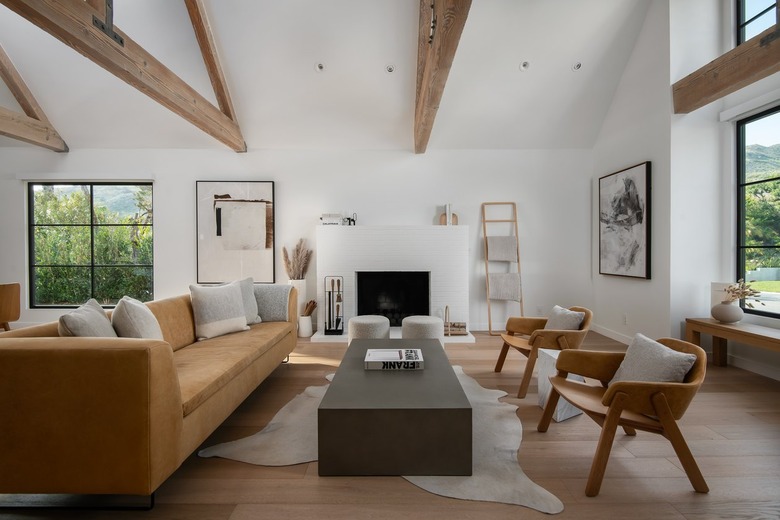A Scandinavian living room with a light brown coach