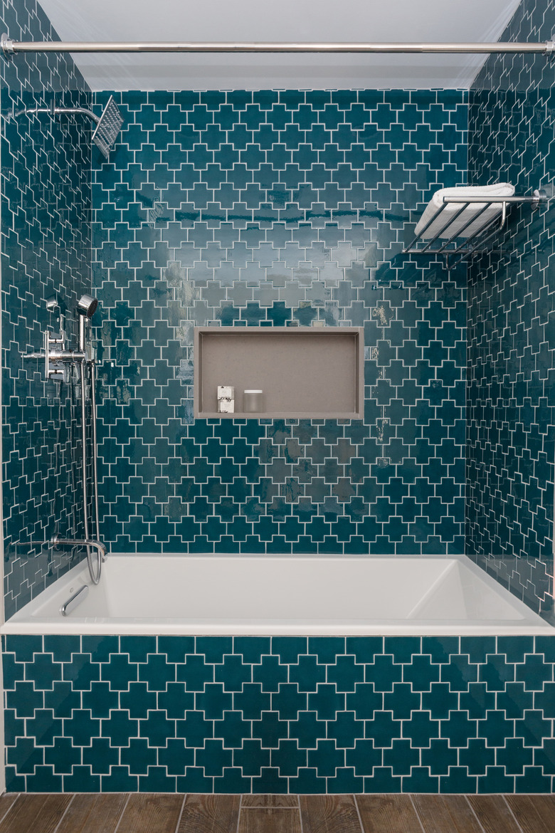 bathtub with teal blue tile