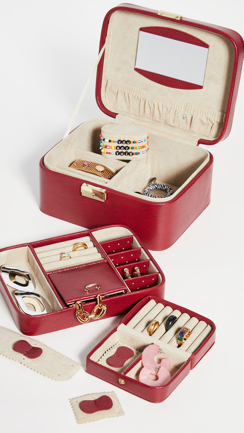 red jewelry organizer with inlays and jewelry inside