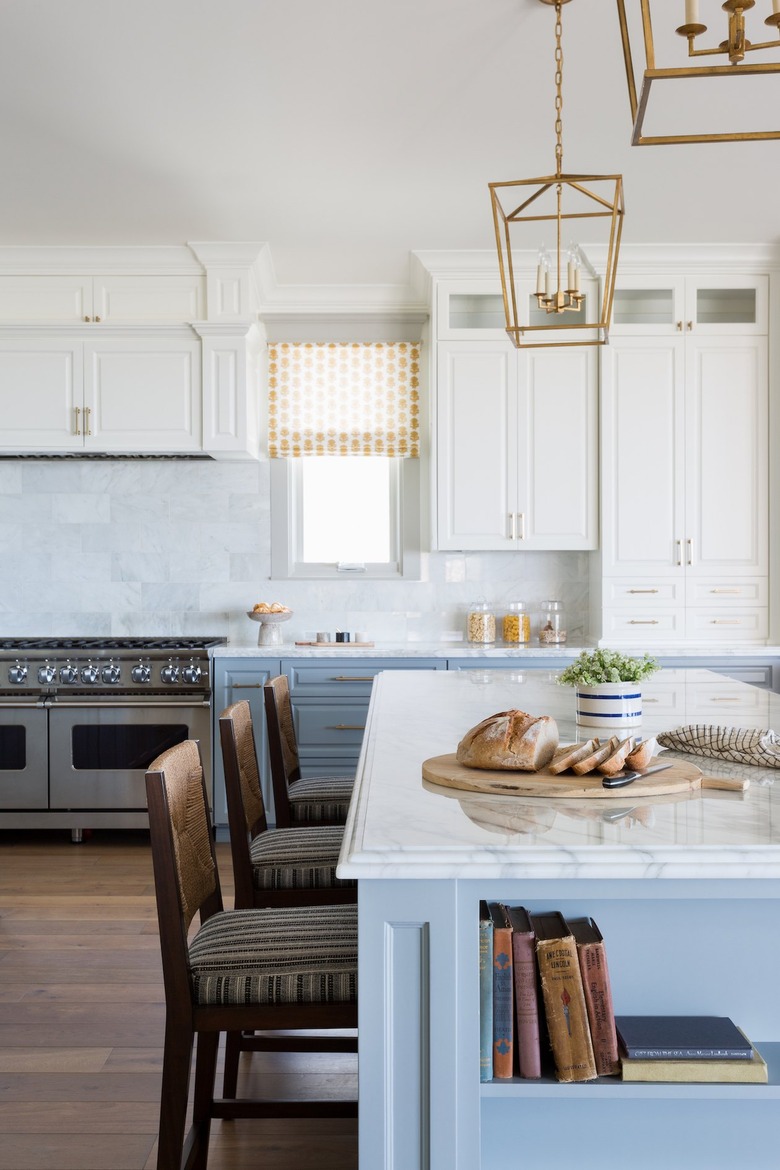 kitchen area with barstools and white cabinets