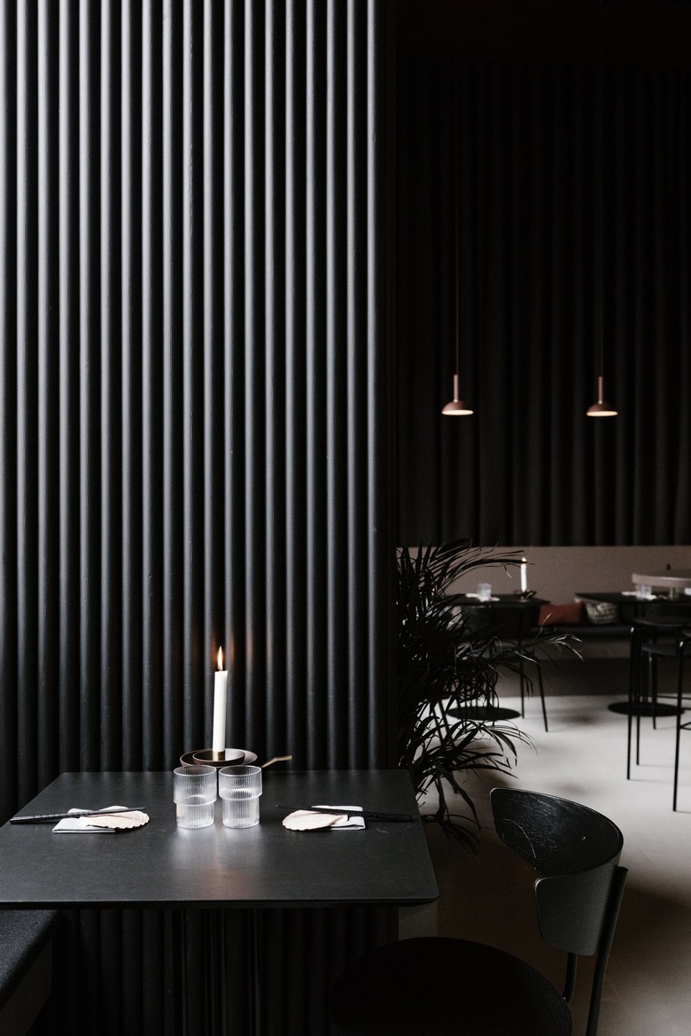 Minimalist bar with black dining furniture