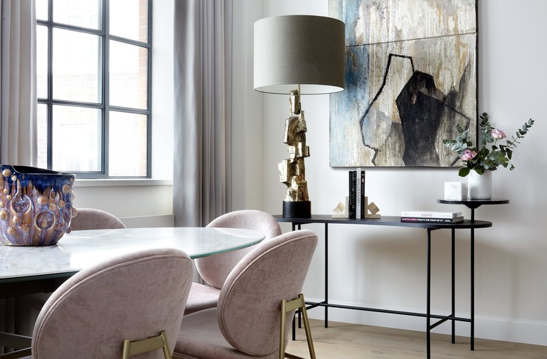 dining area with pink chairs