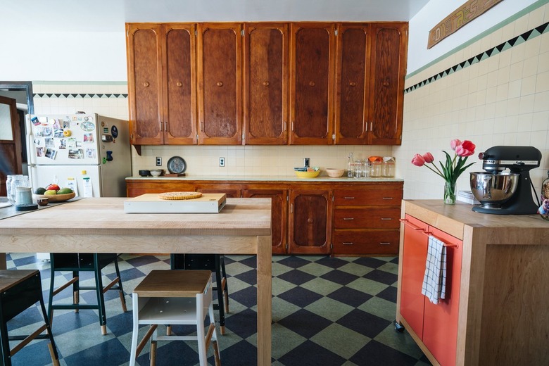 Kitchen with wood cabinets and dining table