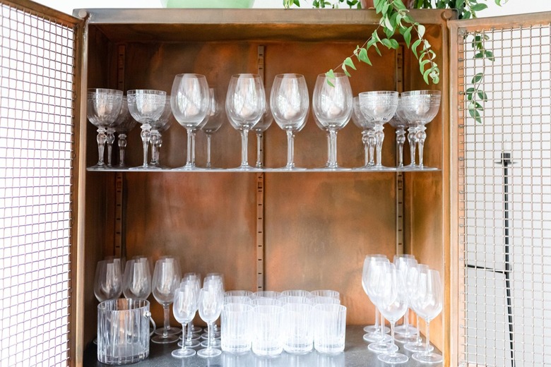 glassware in wood cabinet