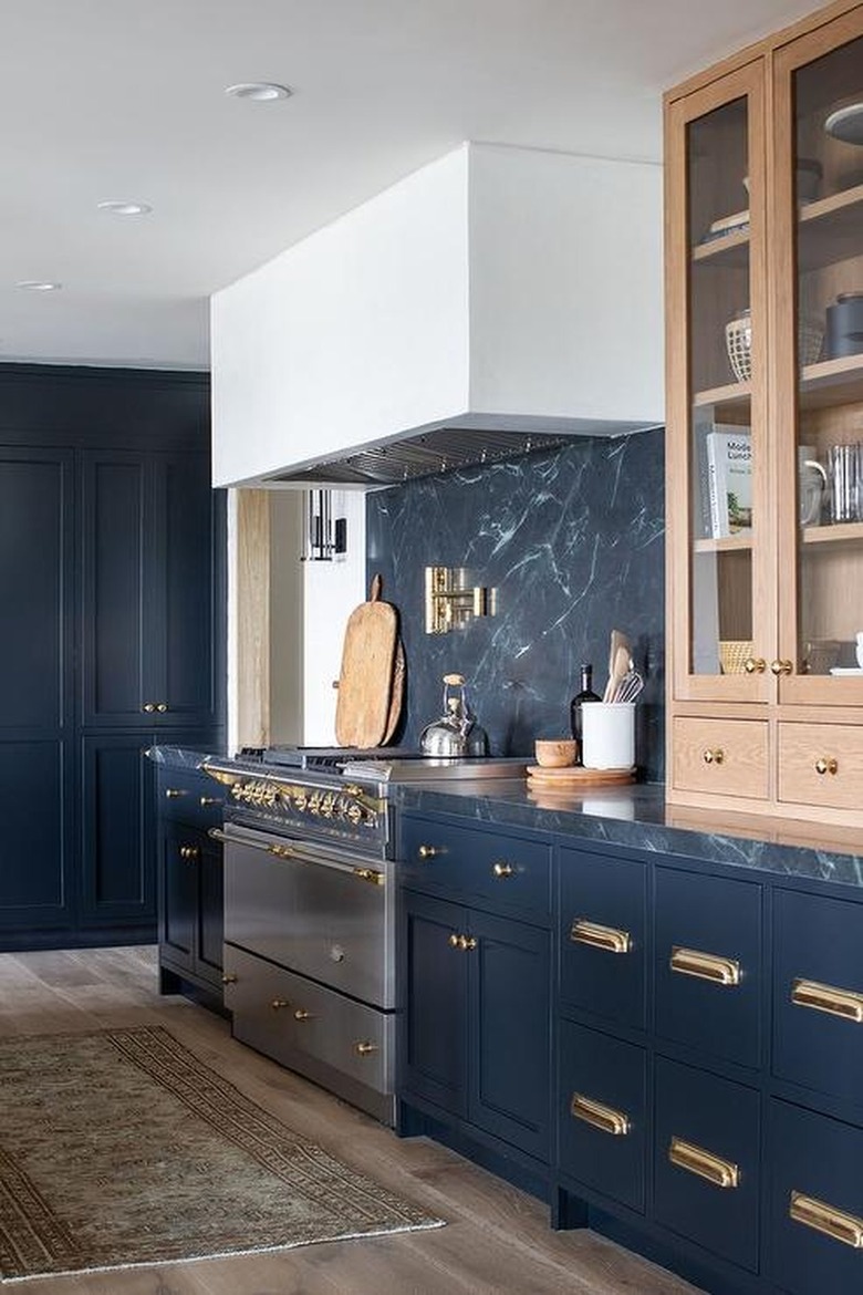 kitchen with light brown cabinets and blue walls