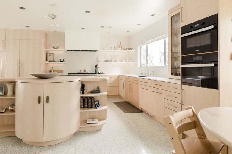 Minimalist kitchen with a curved kitchen island