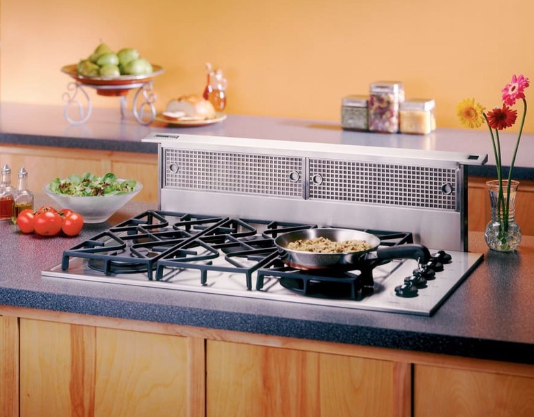 Cooktop with downdraft hood.