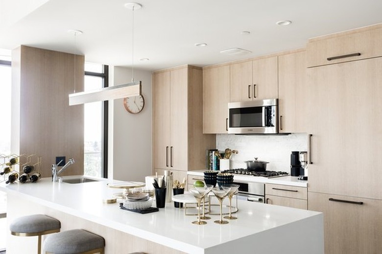 Modern kitchen with light wood cabinets