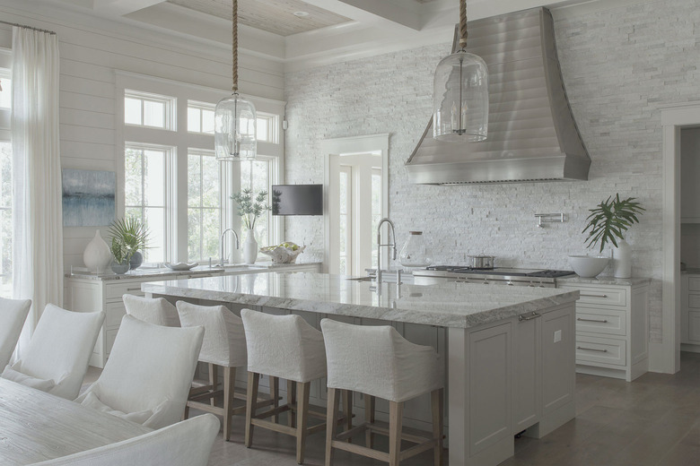 White kitchen with stainless hood