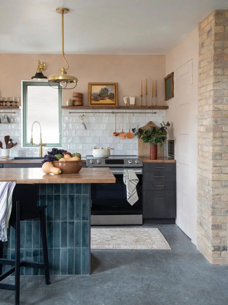 small kitchen with island showcasing tile on base and butcher block countertop