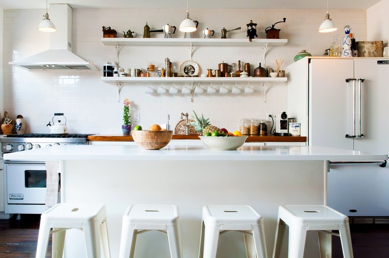 a kitchen with open shelving