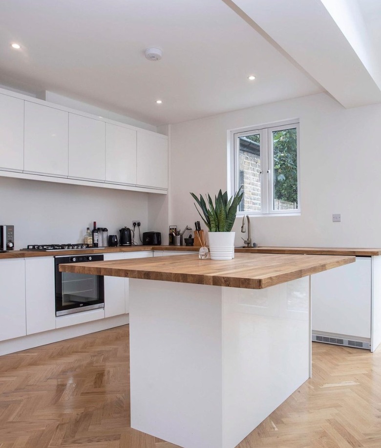 white kitchen with butcher block counters