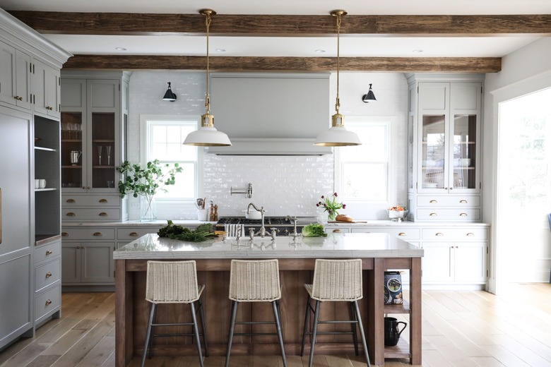 white and brass barn lights hanging in farmhouse kitchen
