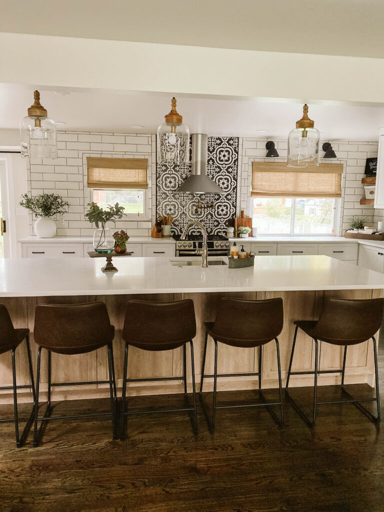 clear glass lights above island in modern farmhouse kitchen