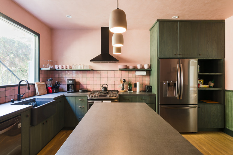 view of kitchen island with dark countertop