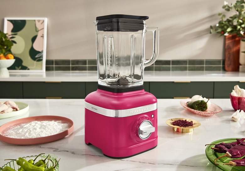 A Hibiscus KitchenAid blender rests on a kitchen counter