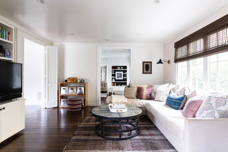 neutral-color living room with hardwood flooring