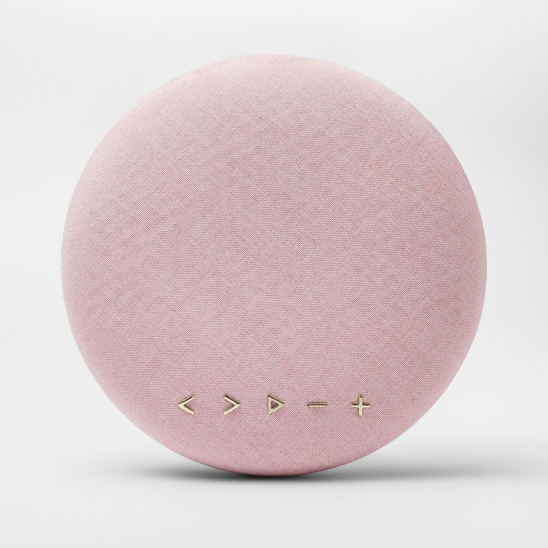 pink round speaker with gold buttons