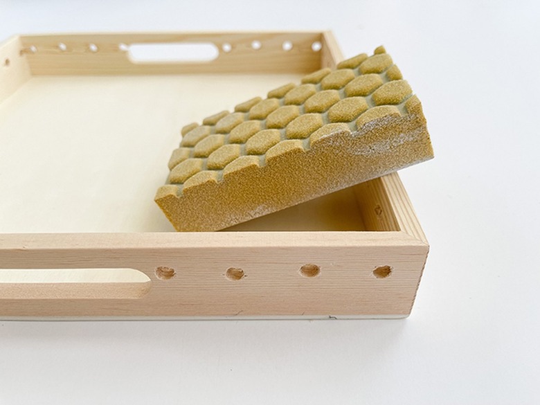 Sand the drilled holes smooth using a sanding sponge.