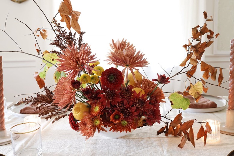 DIY lemon and floral centerpiece on Thanksgiving holiday table