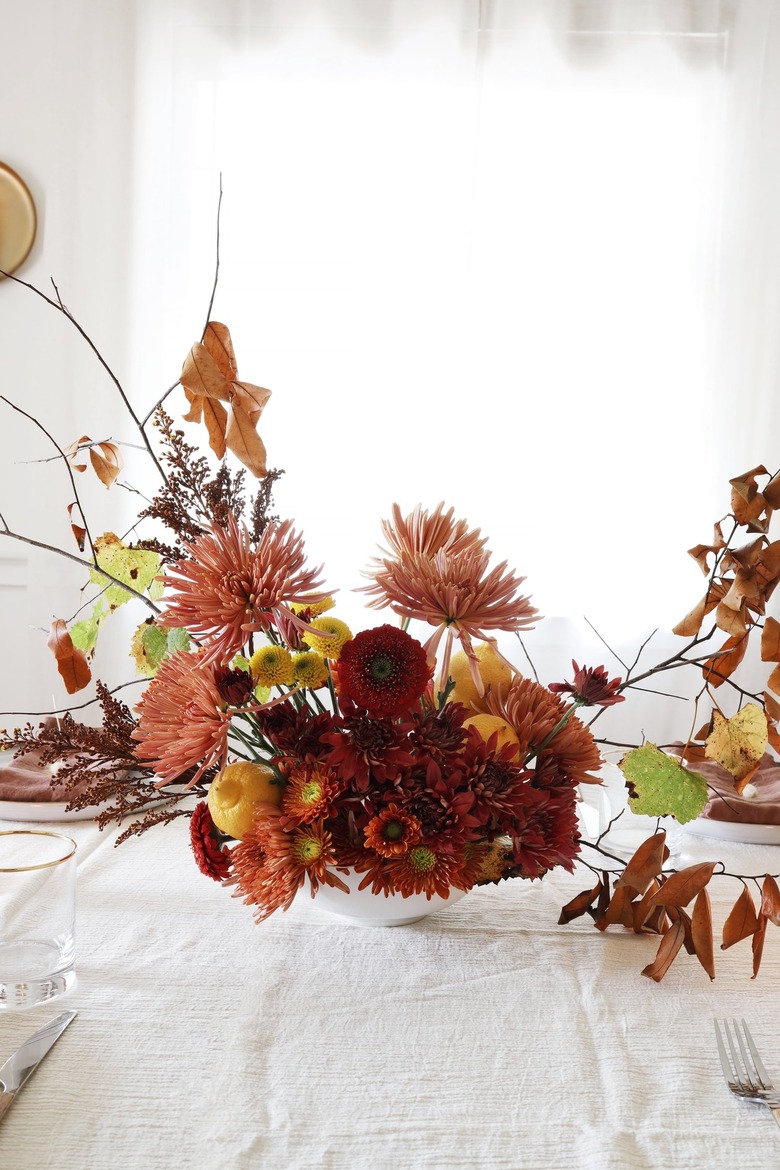 Lemon with fall flowers and foraged branch centerpiece
