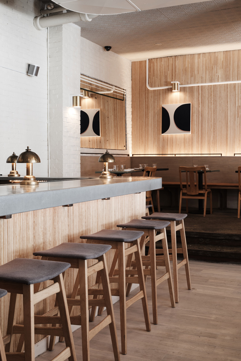 Side shot of the bar facing the De Maria dining room.