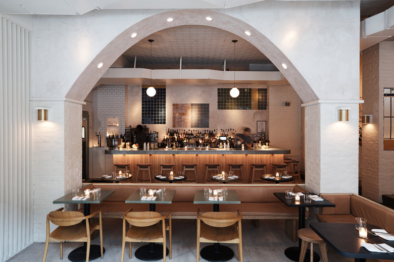 Shot of De Maria bar with the arch separating bar from dining room.