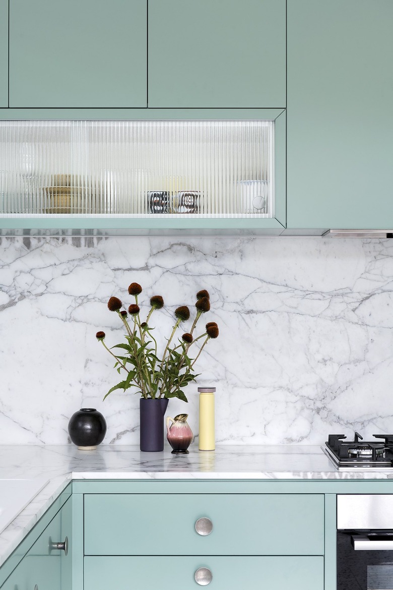 A fluted-glass display cabinet in the kitchen.