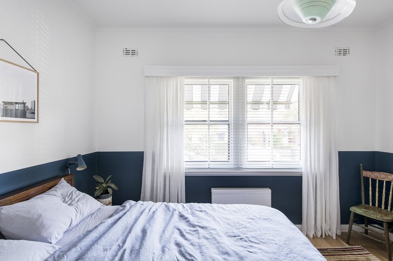 The main bedroom features the client's vintage furniture.