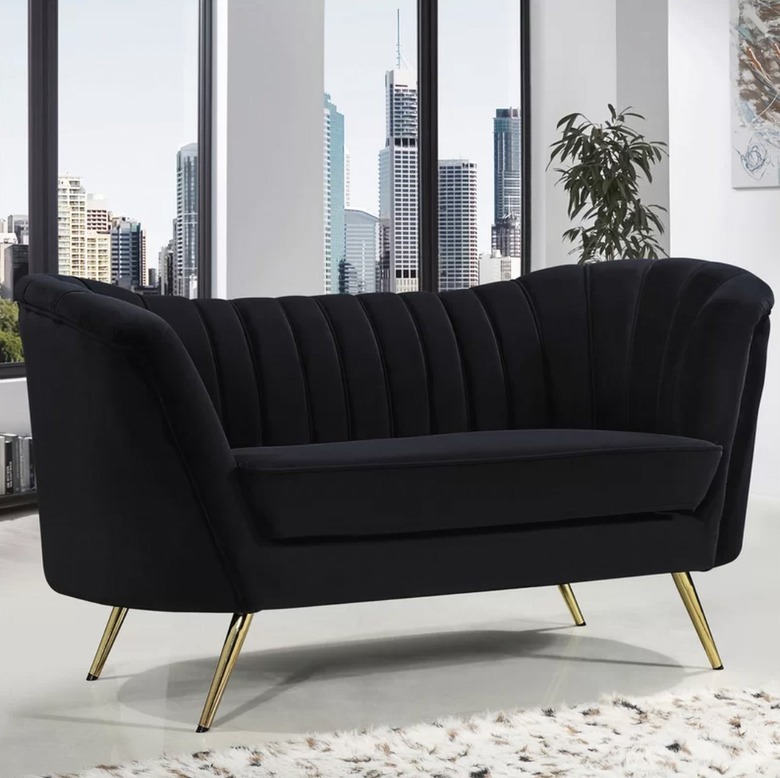 black velvet lovseat with tufted back cushion