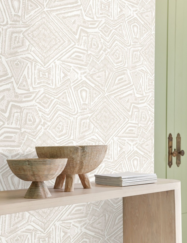 patterned wallpaper with console and bowls