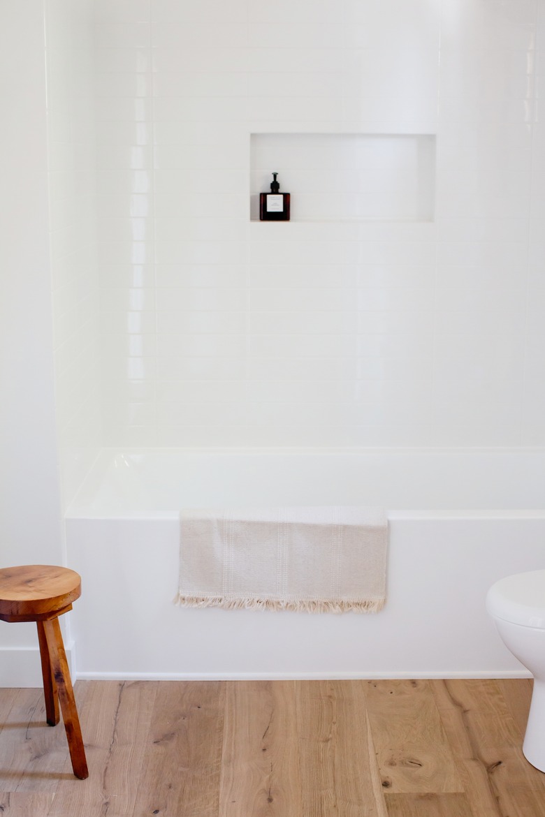 white vinyl bathtub and shower installation