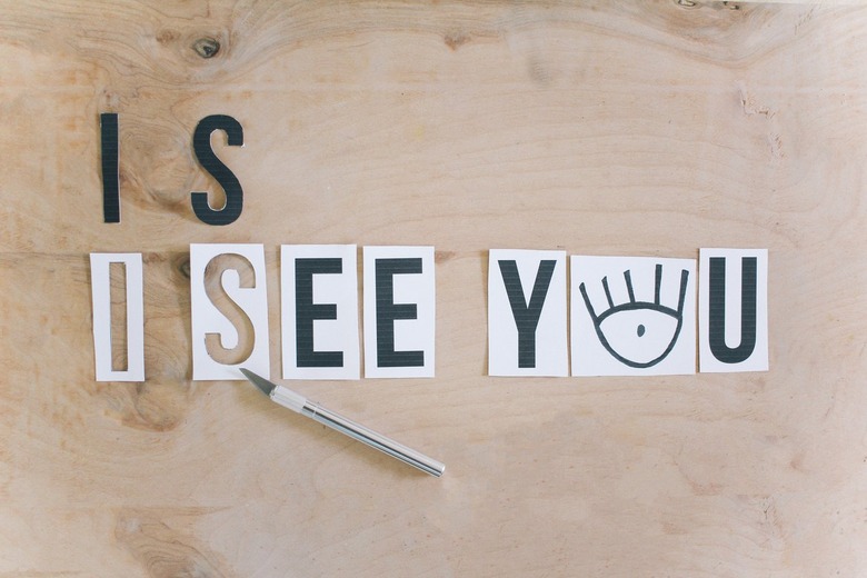creating templates for the i see you message by cutting printed letters with a utility knife