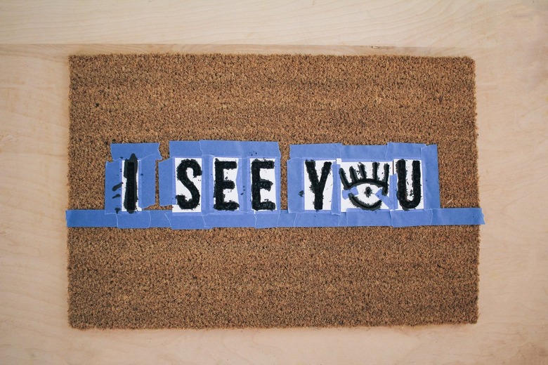 Painting doormat with stenciled letters