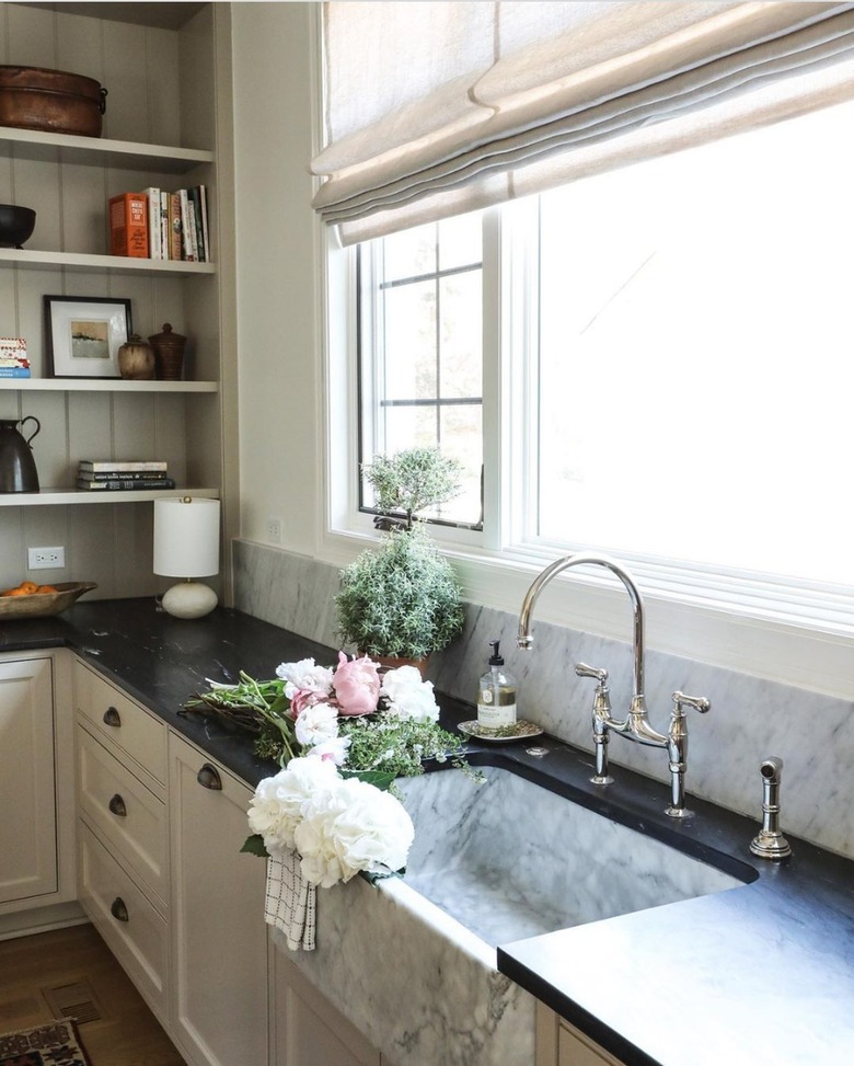 white and gray apron front marble kitchen sink with soapstone countertop
