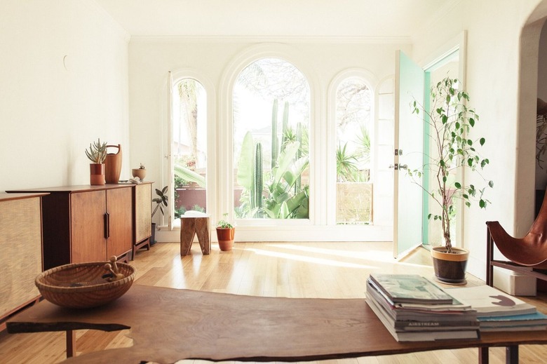 minimalist midcentury room with arched windows