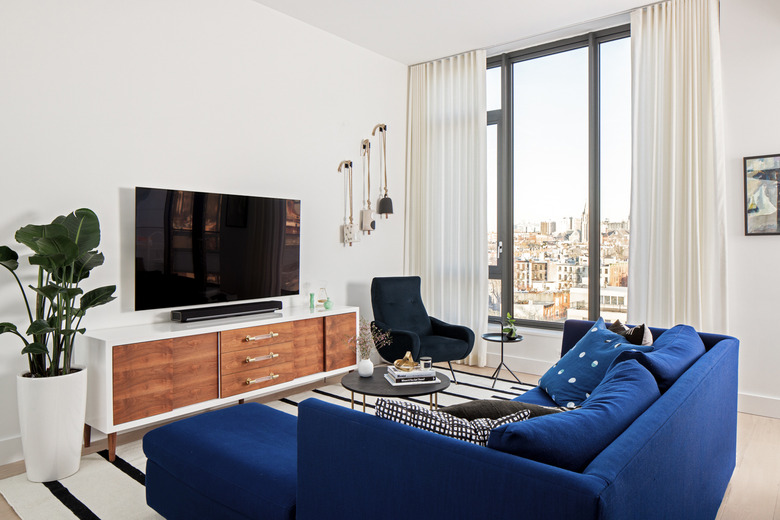 Living room with blue velvet couch
