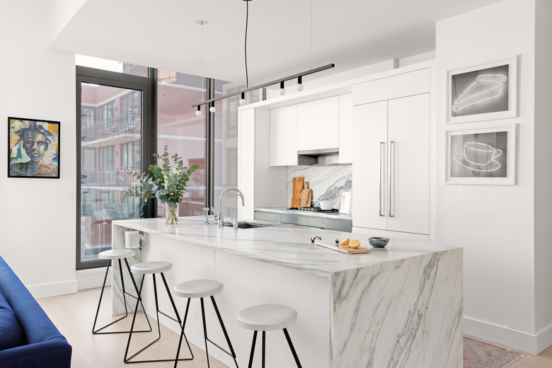 Kitchen with marble island and backsplash