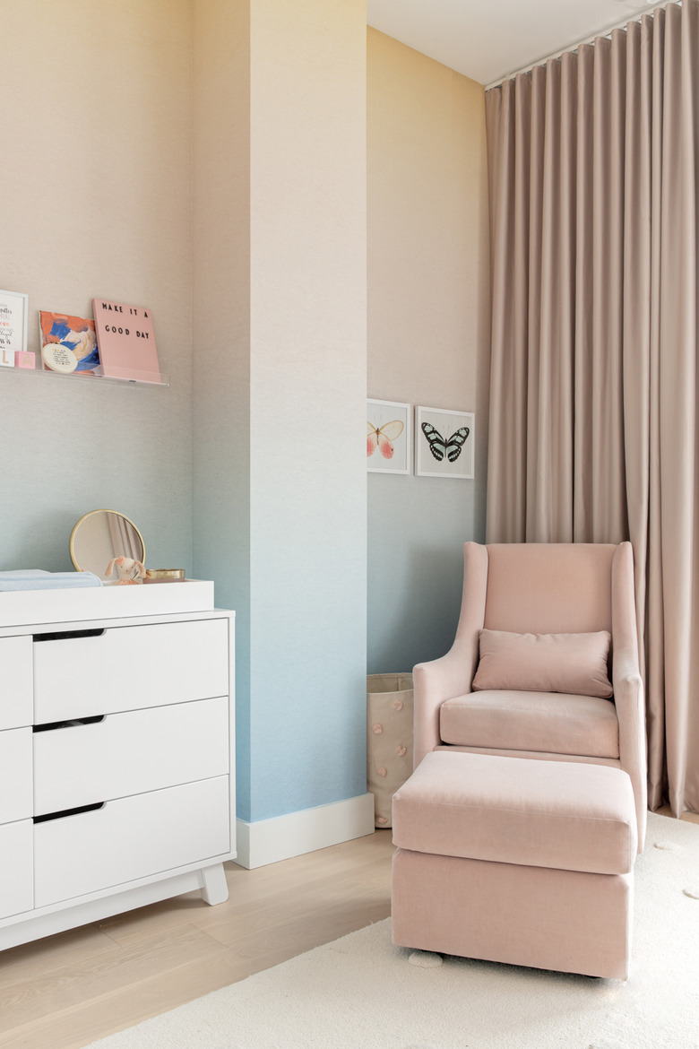 Nursery with pink and blue wallpaper